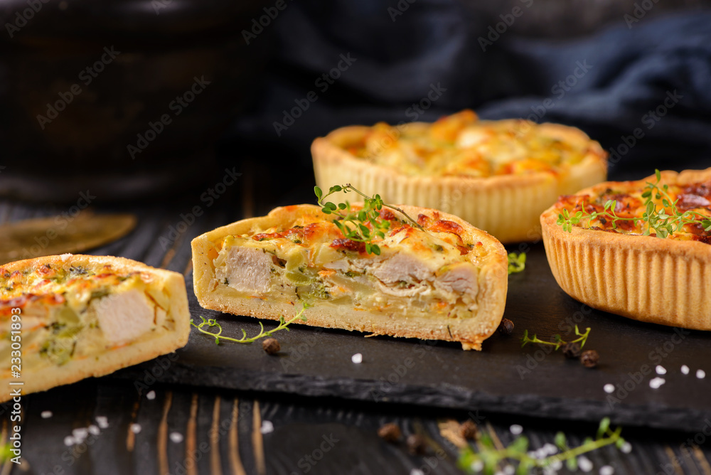 Meat mini pie on the wooden board on table background, closeup with copy space, rustic style