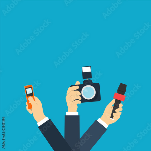 Journalists hands holding camera, microphone and voice recorder.