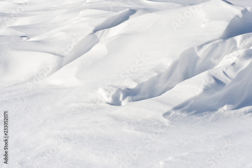 Wind sculpted patterns on snow surface.