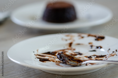 White empty dirty dish. Chocolate souffle is finished