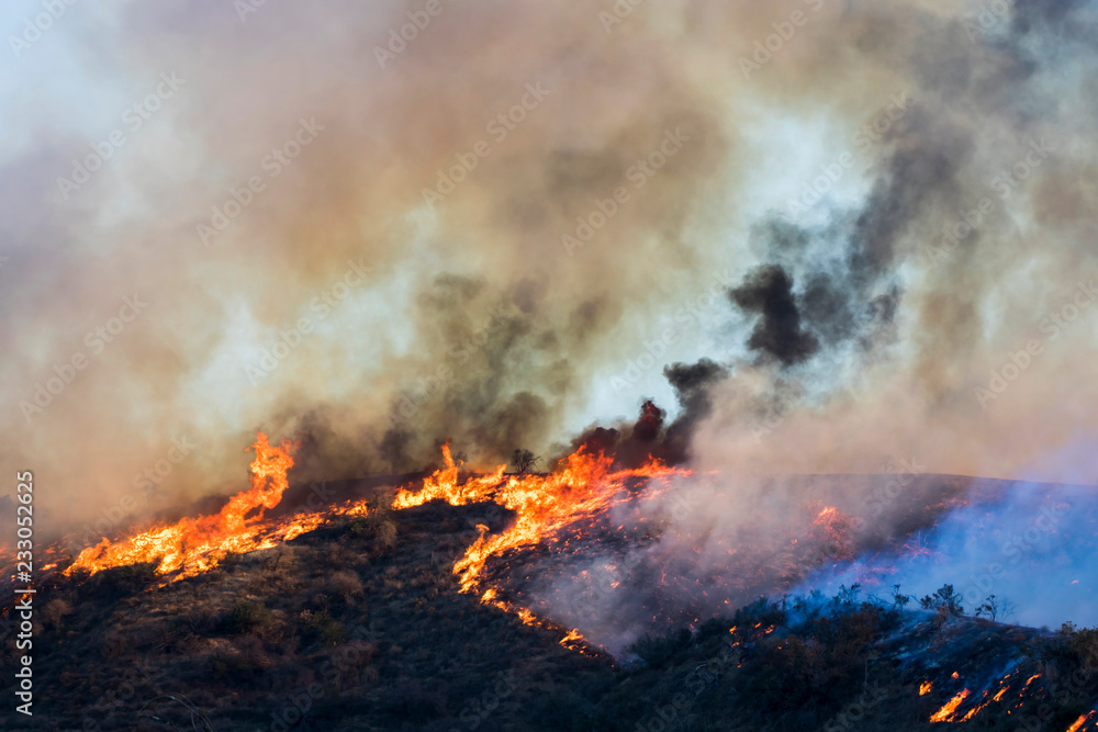 Wildfire Burns Hill with Flames and Dramatic Smoke Formations during Woolsey Fire California