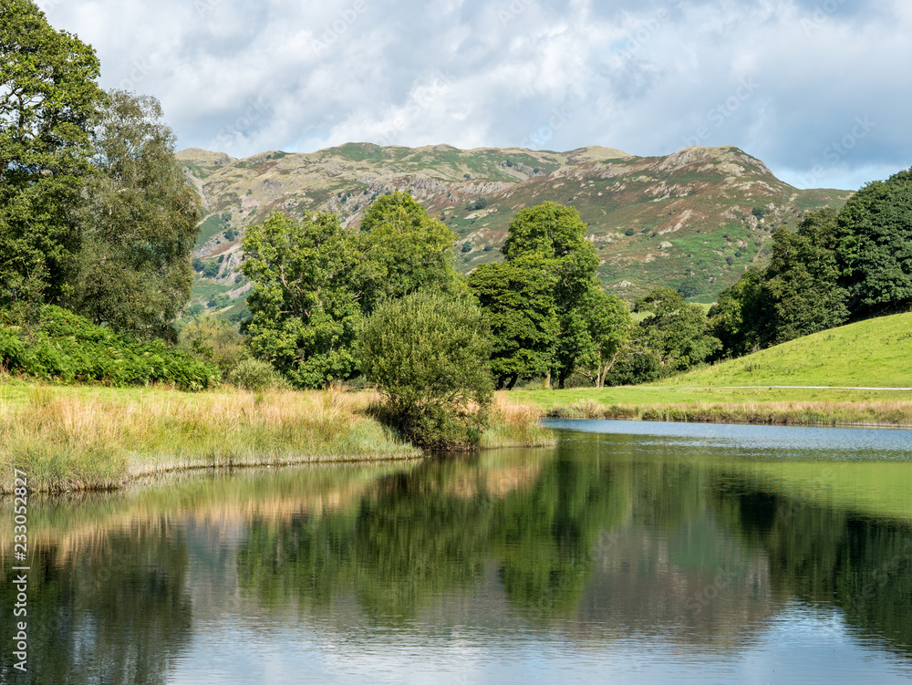 View of Langdale Fells across Elterwater in Cumbria, England View of Langdale Fells across Elterwater in Cumbria, England
