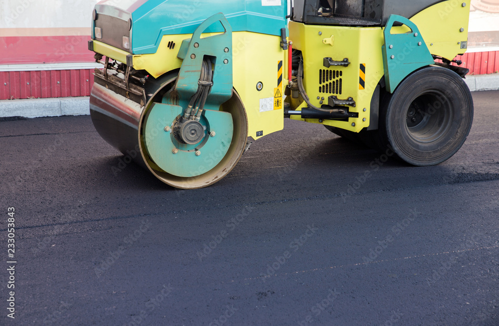 Works road roller with asphalt
