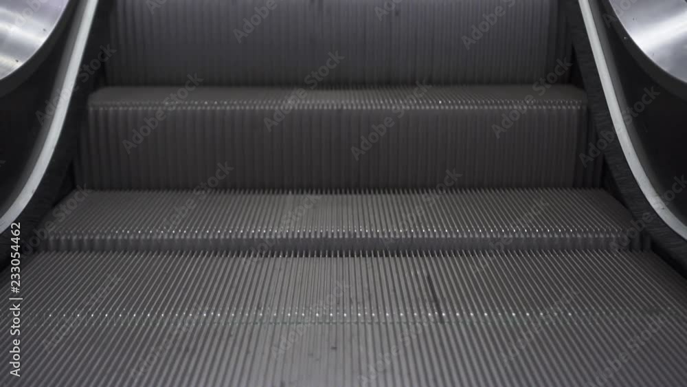 Close up of empty Escalator from the bottom, Moving down Close up of empty Escalator from the bottom, Moving down