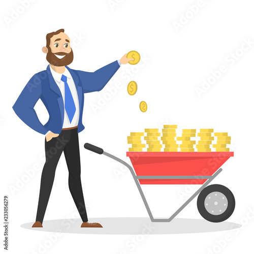 Hapyy businessman standing with wheelbarrow full of cash photo