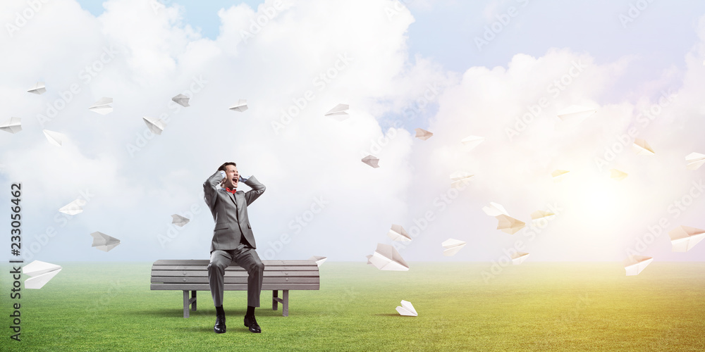 Young man in suit in park dont want to hear anything Young man in suit in park dont want to hear anything