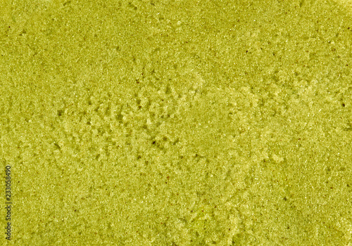 Fresh juicy grape paste texture. Bright pistachio green fruit background.