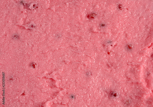 Rich soft mixed berry surface. Fresh juicy paste. Creamy background close up.