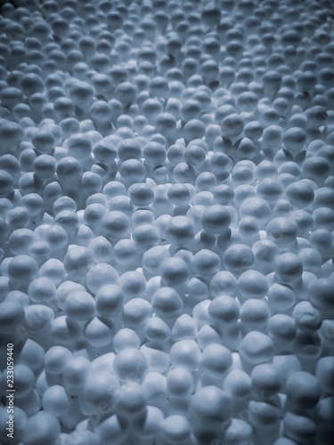 zoomed white expanded polystyrene pellets for production plastic bags.Polystyrene pellets on bright background.