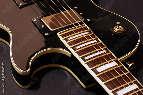 Close-up electric guitar strings, music instrument in studio photo