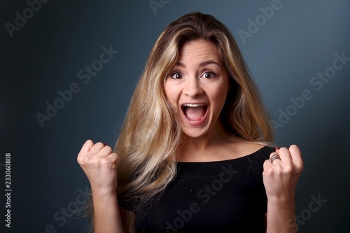 Portrait of a caucasian woman in front of a blue background