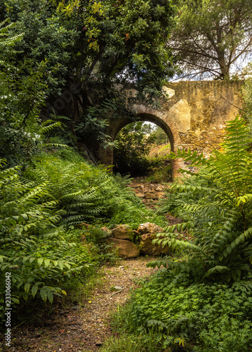 Aqueduct of Saint Telmo in Malaga, Spain, work of historical engineering declared as a construction of cultural interest. Building surrounded by vegetation. © Kemedo