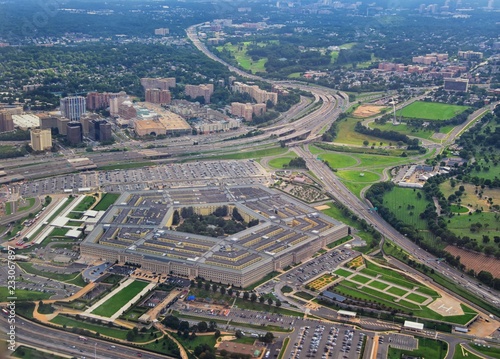 Aerial view of the United States Pentagon, the Department of Defense headquarters in Arlington, Virginia, near Washington DC, with I-395 freeway and the Air Force Memorial and Arlington Cemetery nearb