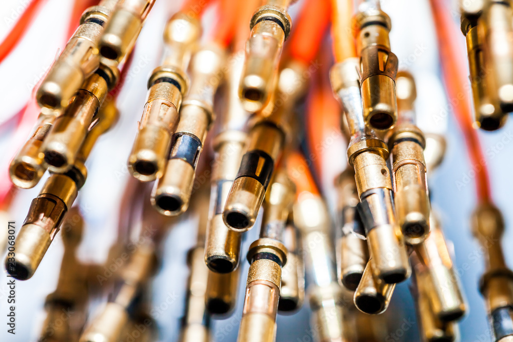 Naklejka premium Miniature brass pins connectors, close-up