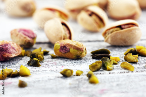 Pistachios, Roasted pistachio seeds in shells and shelled. Green, dried fruits, whole and chopped