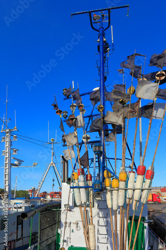 Ustka, Pomerania, Poland - Ustka fishing port with cutters and peers at the Baltic Sea shoreline photo