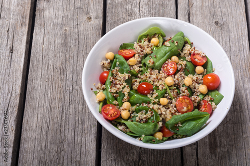 Spinach salad with quinoa , tomatoes and chickpea