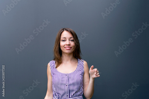 Smiling woman on dark background