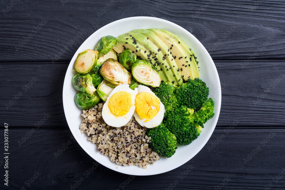 Buddha bowl with quinoa , eggs , avocado , brussels sprouts and broccoli Buddha bowl with quinoa , eggs , avocado , brussels sprouts and broccoli