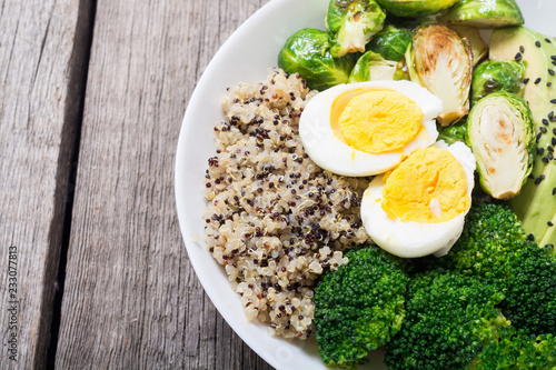 Buddha bowl with quinoa , eggs , avocado , brussels sprouts and broccoli