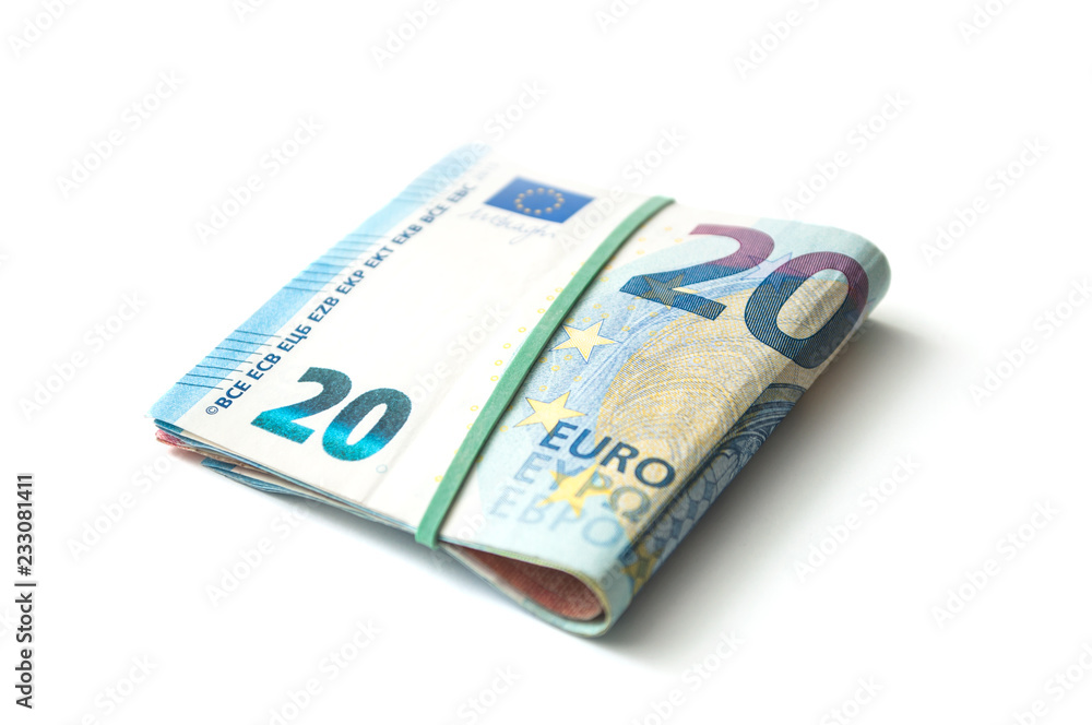closeup of banknotes bundle of twenty euros money on white background closeup of banknotes bundle of twenty euros money on white background