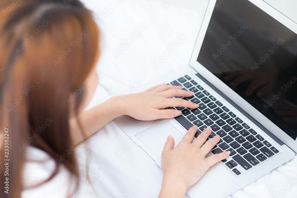Closeup young asian woman using laptop for leisure on bedroom, girl working online with notebook freelance, business concept, top view. Closeup young asian woman using laptop for leisure on bedroom, girl working online with notebook freelance, business concept, top view.