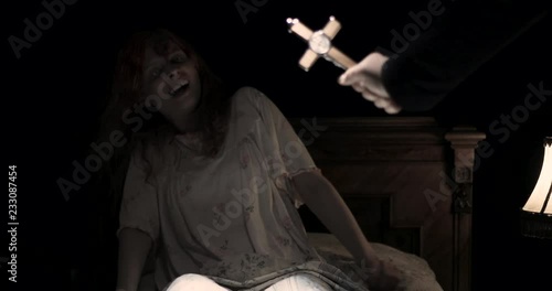 the priest with the cross do an exorcism the obsessed girl
