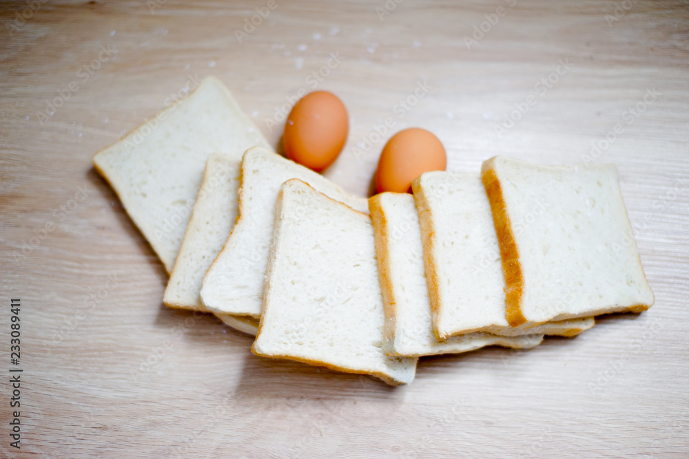 Homemade breads or bun on wood background, egg, breakfast food Homemade breads or bun on wood background, egg, breakfast food