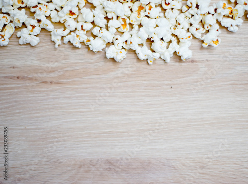 Wooden background with popcorn