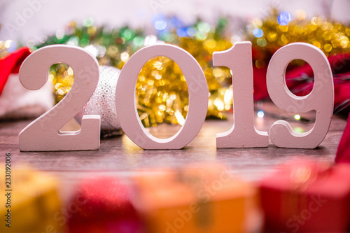2019 number with Christmas and New Year decorations background.