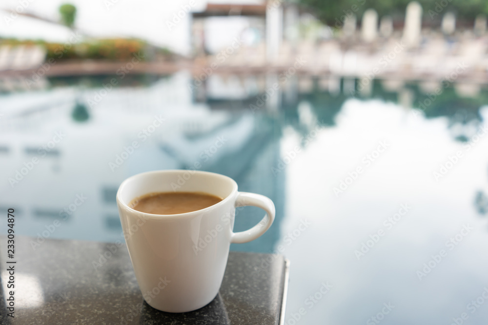 Latte Coffee in the breakfast set by the swimming pool Latte Coffee in the breakfast set by the swimming pool