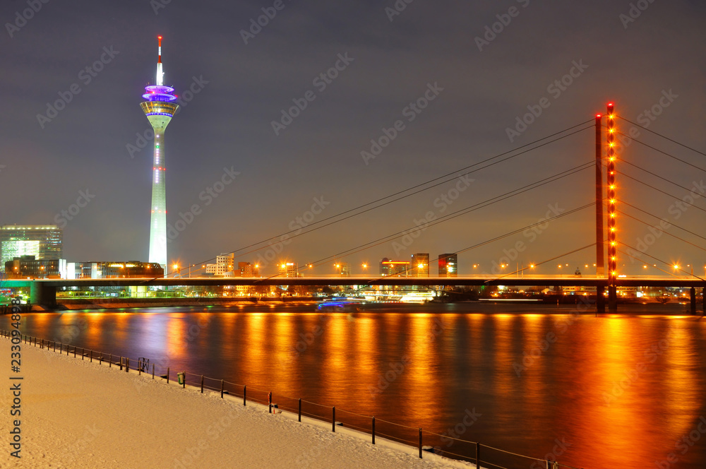 Beautiful night shore of Rhein river at night in Dusseldorf with
