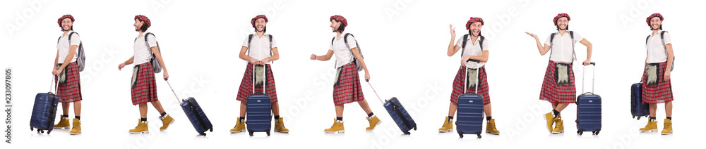Man in scottish skirt with suitcase isolated on white