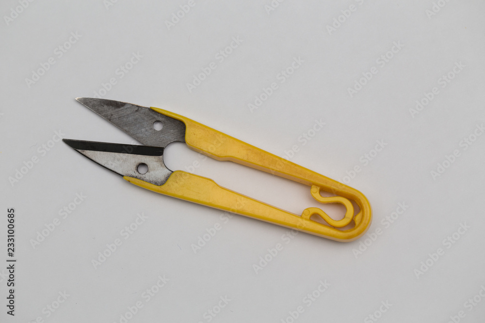 Small yellow tailor scissors isolated on white Small yellow tailor scissors isolated on white