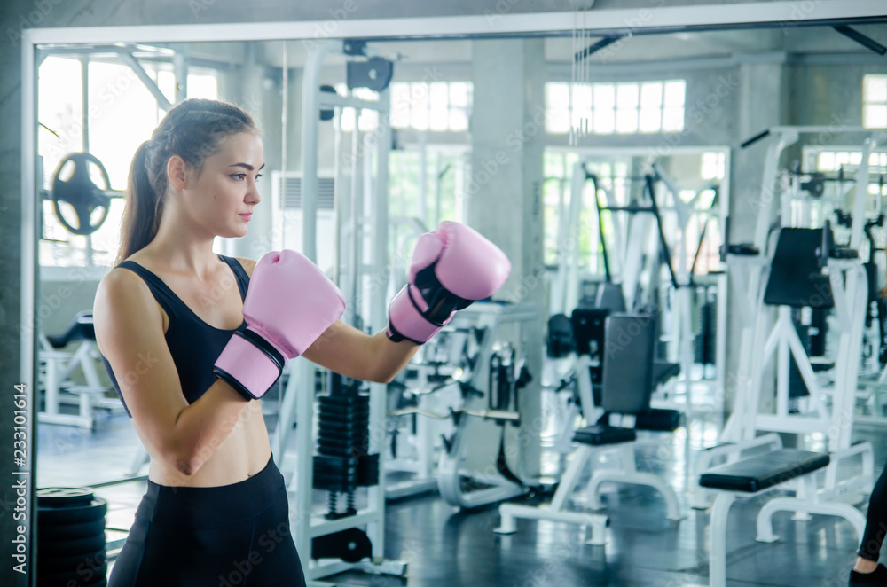 Attractive Female Boxer At Training in gym Attractive Female Boxer At Training in gym