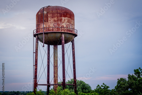Rusty water tower - Abandoned and forgotten photo