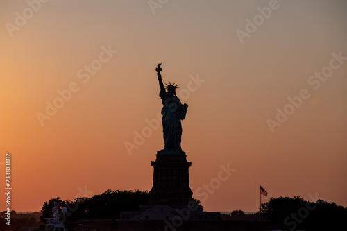 Scenic view at Statue of Liberty at a sunset.