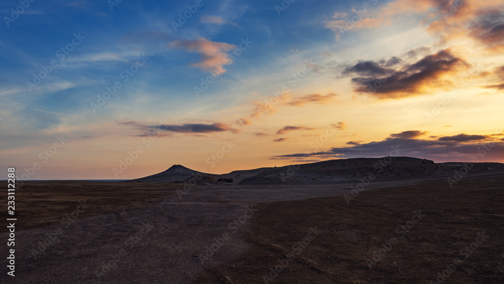 Mud volcanoes at sunset, beautiful amazing sky