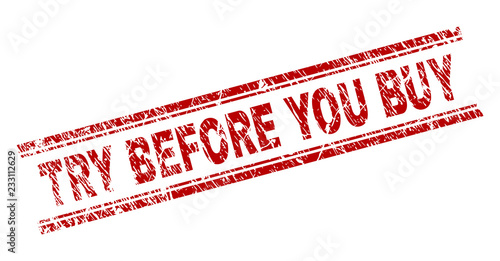 TRY BEFORE YOU BUY seal print with corroded texture. Red vector rubber print of TRY BEFORE YOU BUY label with corroded texture. Text title is placed between double parallel lines.