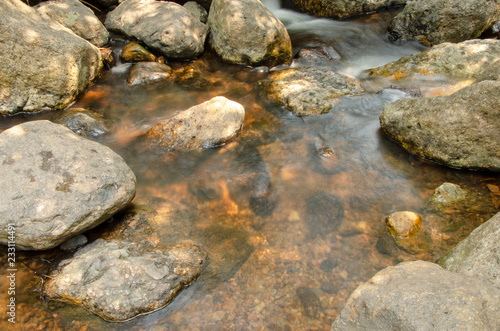 The rocks flowing at the waterfall.