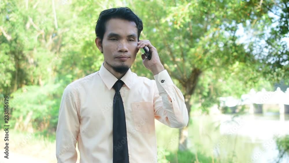 Businessman holding smart phone or mobile phone using call and happy smile success Businessman holding smart phone or mobile phone using call and happy smile success