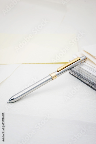 a silver pen on paper