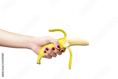 Woman hand holding banana for illustration of premature ejaculation or sexual dysfuncion photo