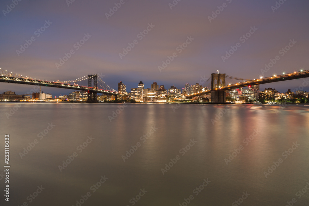 View on Dumbo location with Manhattan bridge and Brooklyn bridge from east river at night,long eposure photo