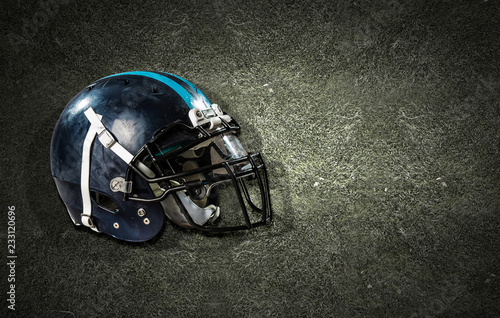 American football helmet on grass