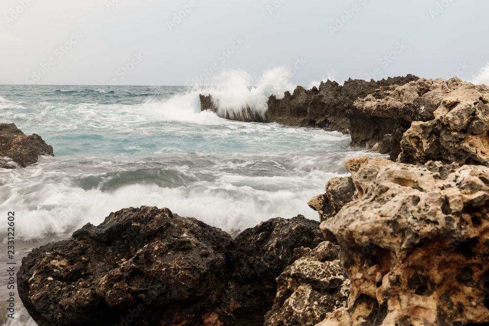 rocky coast texture creating amazing patterns and sea with waves in the background rocky coast texture creating amazing patterns and sea with waves in the background