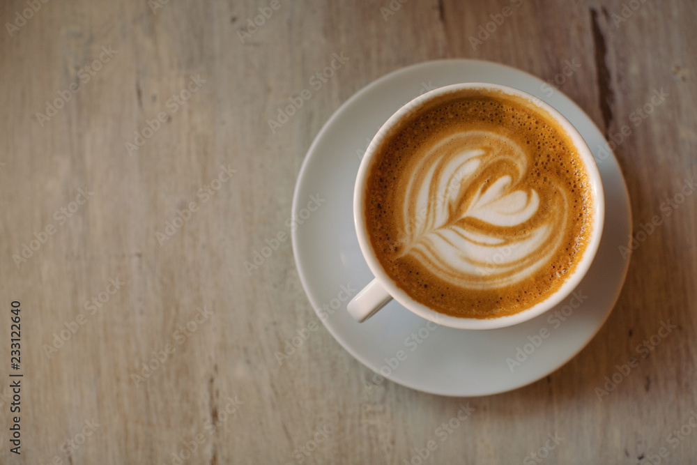 cup of coffee on wooden background cup of coffee on wooden background