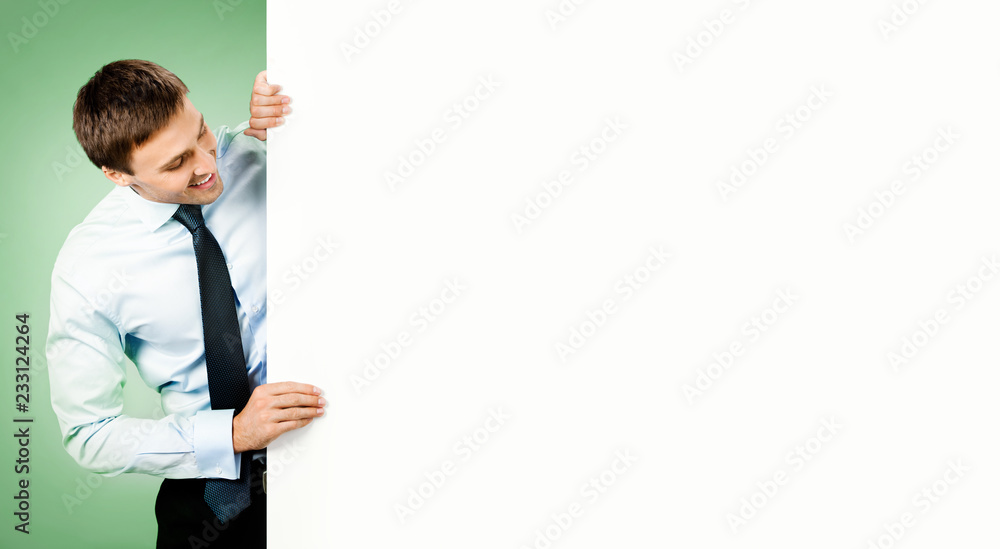 Businessman showing blank signboard Businessman showing blank signboard