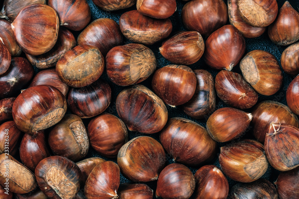 Roasted chestnuts served on an old table Roasted chestnuts served on an old table