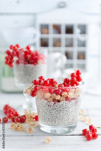 Chia pudding with redcurrants and whitecurrants photo